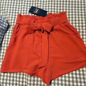 Chic High-Waisted Rust Shorts with Bow Detail